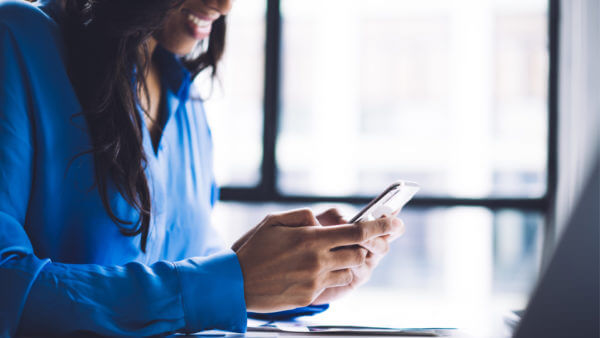 smiling woman with mobile